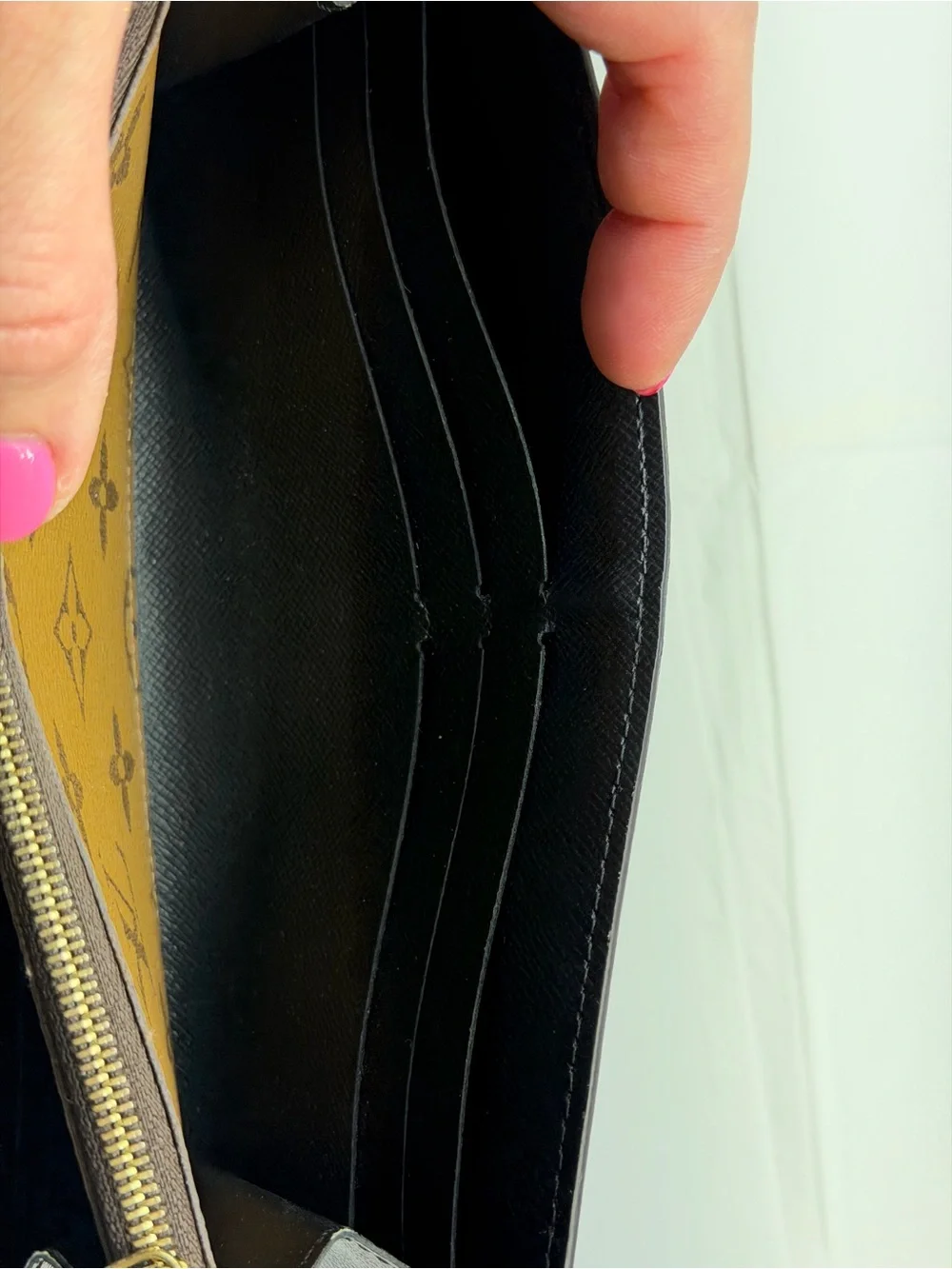 Louis Vuitton Sarah wallet in reverse monogram